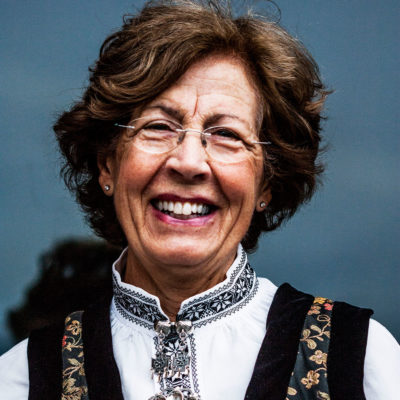 Norwegian Woman Wearing the Traditional Costume on the Bryggen Dock in Bergen
